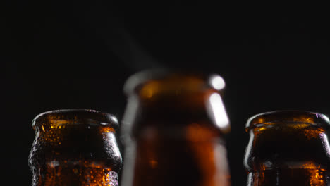 Close-Up-Of-Condensation-Droplets-On-Neck-Of-Bottles-Of-Cold-Beer-Or-Soft-Drinks-With-Water-Vapour-After-Opening-2